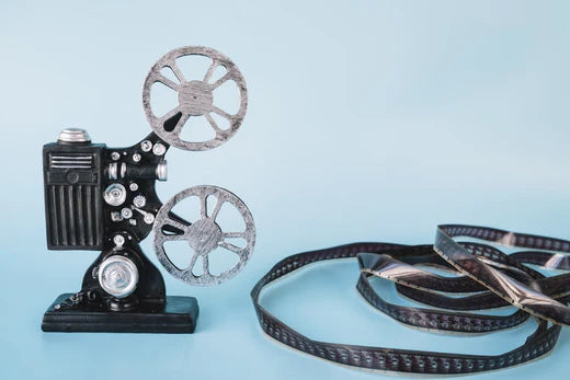 Video, cinema concept. Vintage film movie projector and reels on