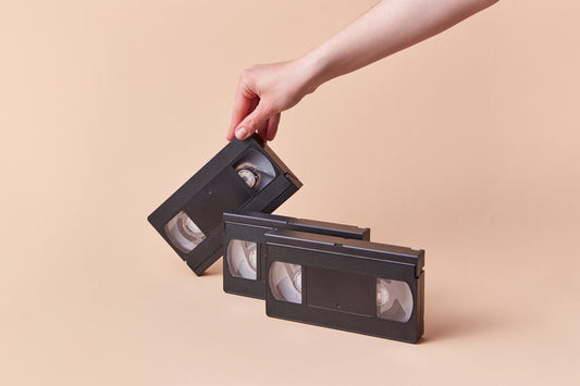 Person Holding Black VHS Tape Wondering How to Store and Preserve VHS Tapes