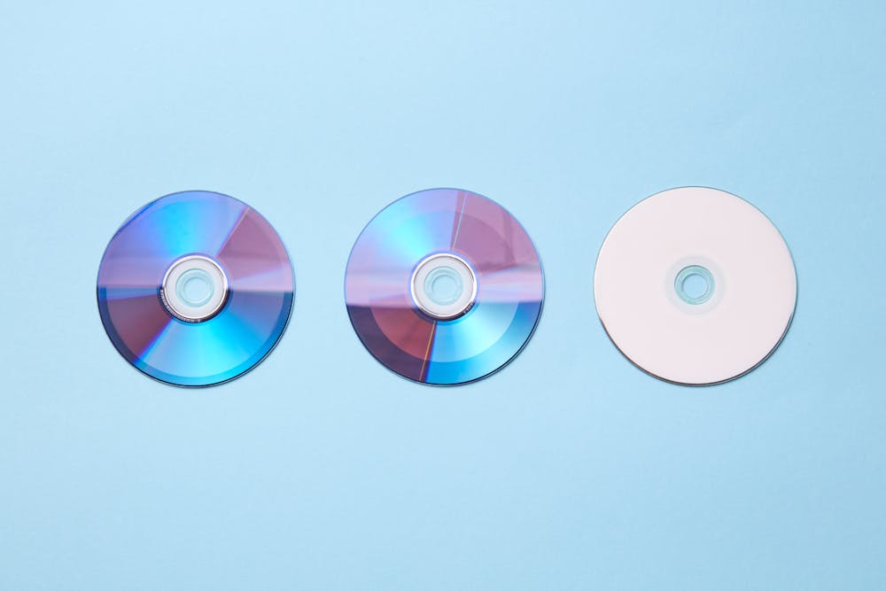 CDs on a blue surface