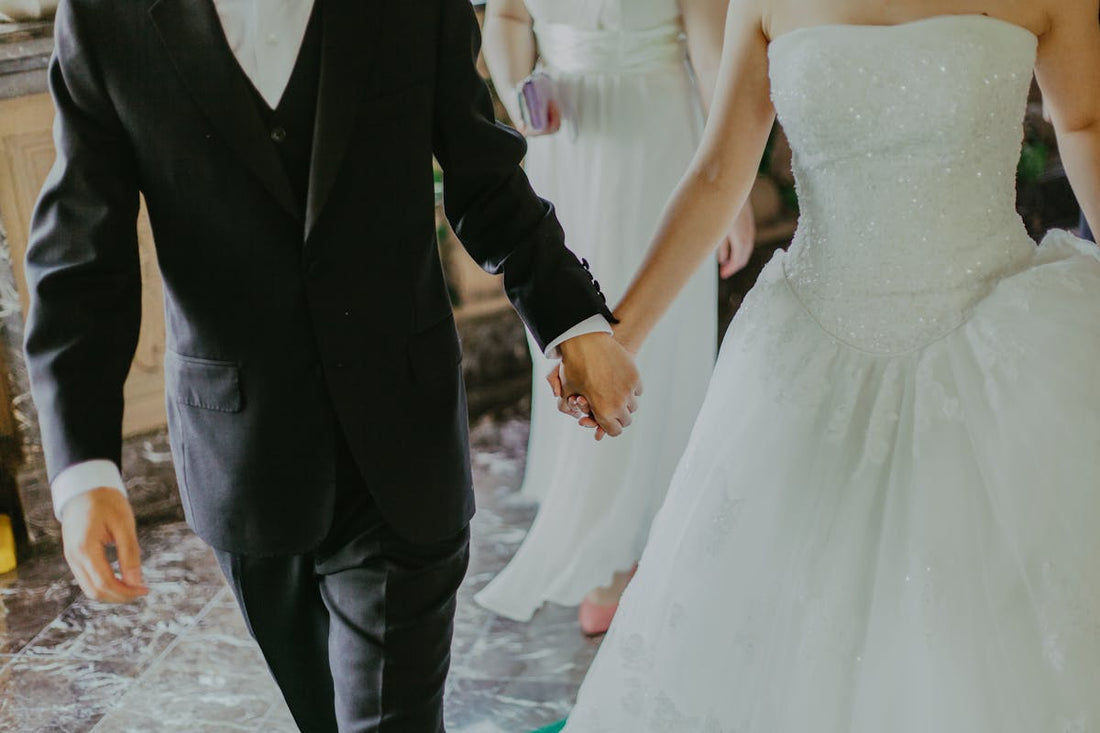  A couple holding hands during a wedding