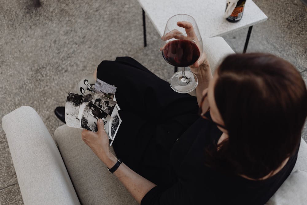 a woman figuring out how to Keep Old Pictures From Fading